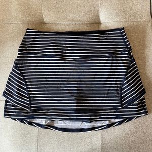 Athleta tennis/golf skort, with built in shorts and pockets, size Medium